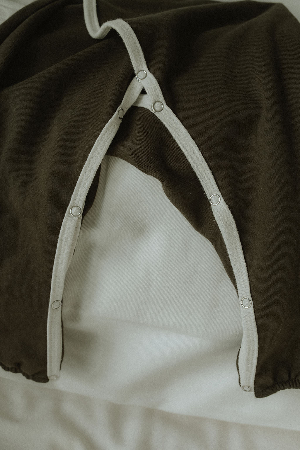 Dark brown garment against a white background