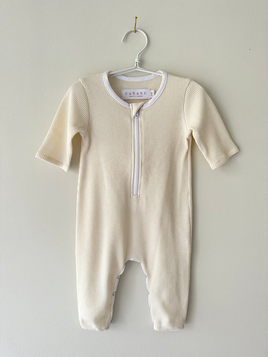 waffle babysuit on hangar with zipper on white background